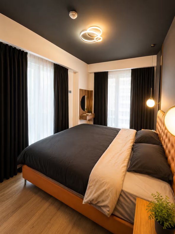 Bedroom 2 with king-size bed and soft lighting