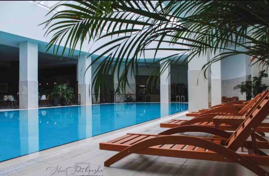 Pool deck and loungers at Sky Wellness